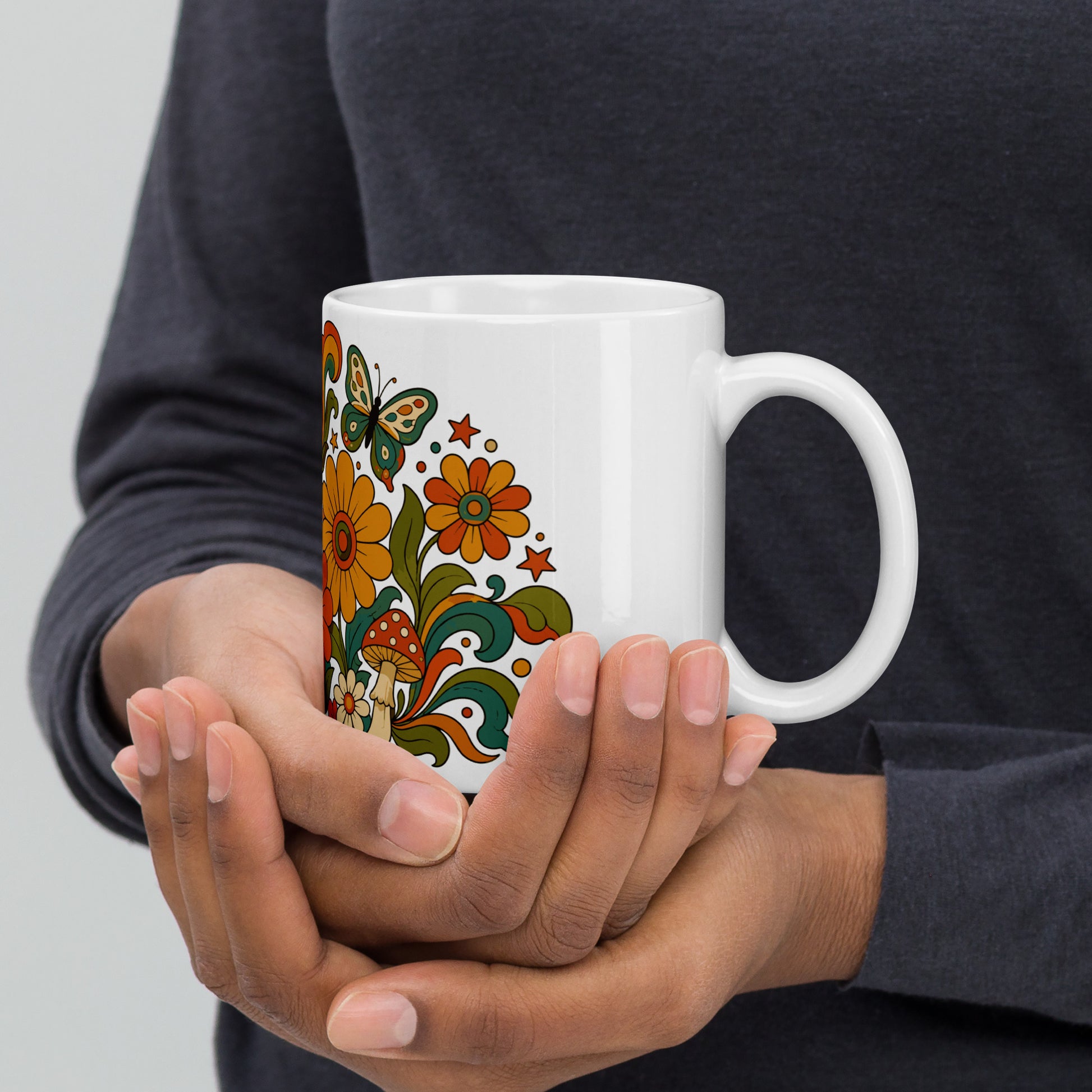 Retro 70s psychedelic ceramic mug featuring smiley daisies, red spotted mushrooms, and colorful butterflies.