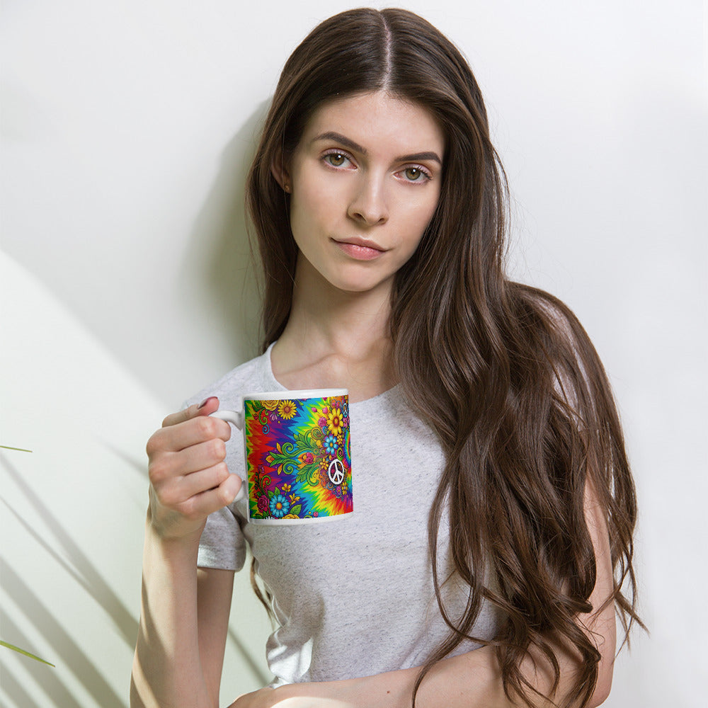 Psychedelic tie dye ceramic mug with vibrant rainbow swirls, peace signs, retro sunflowers, daisies, and butterflies.
