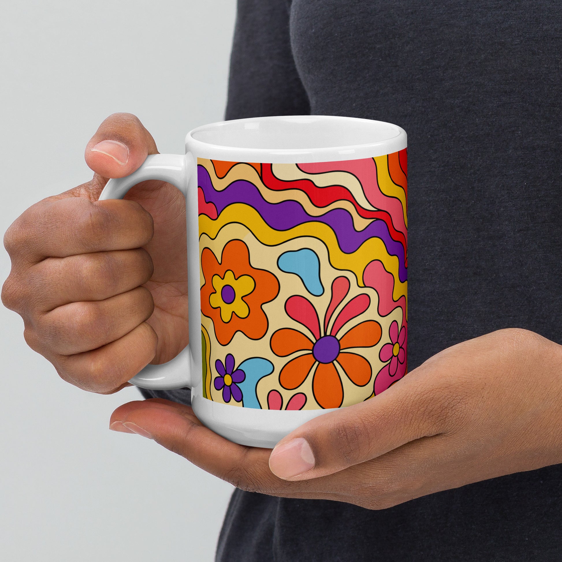 Vibrant 1970s psychedelic ceramic mug featuring a wavy retro sunburst sunset surrounded by colorful groovy flowers.
