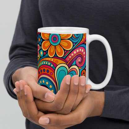 Vibrant retro 70s ceramic mug featuring a psychedelic doodle pattern of colorful flowers, groovy swirls, and hearts.
