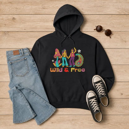 Front view of a cream unisex hoodie featuring a retro 1960s-style "Wild and Free" graphic with colorful vintage flowers.